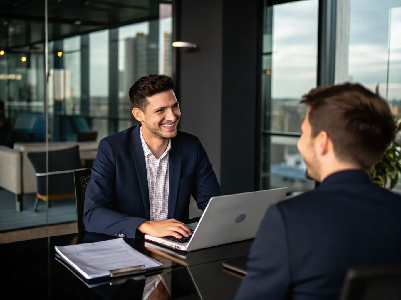 A person participating in a mock interview, receiving constructive feedback from a consultant, illustrating the mock interview stage of the Growth Consultation program.